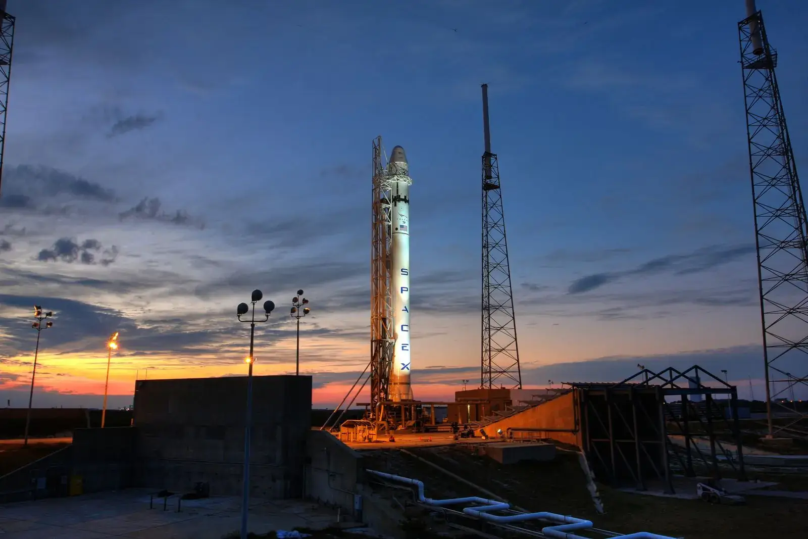 Rocket on a launch pad at sunset